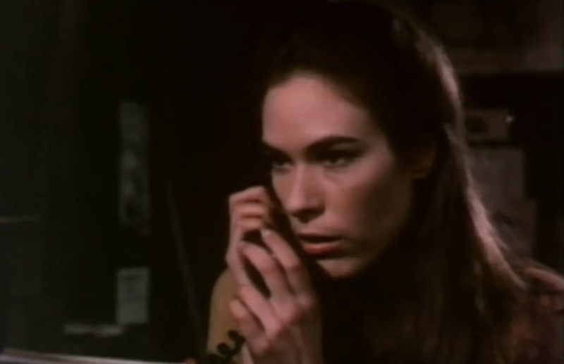 A stranger calls Mary Woronov in Silent Night, Bloody Night.